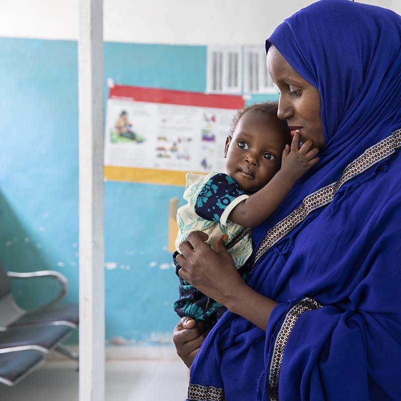 In Somalia, a child receives treatment at a health clinic.